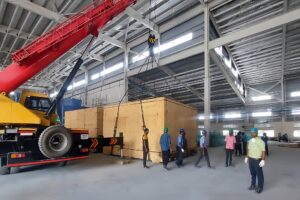 Huge crates of machinery being delivered to factory global customers
