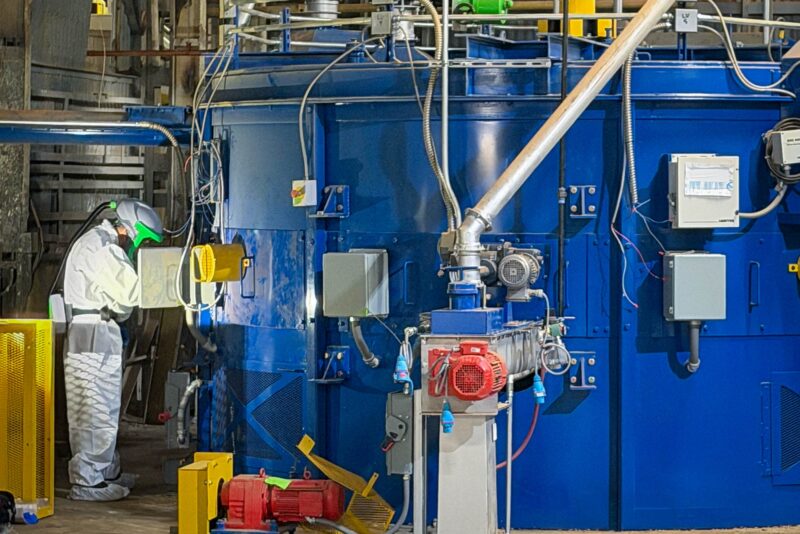 field services; Man in safety-suit working on EAGLE equipment inside a factory
